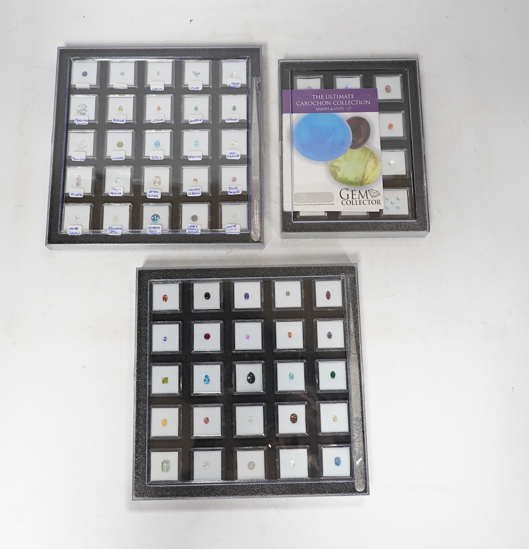 Three boxes containing unmounted cut gemstones including topaz, citrine, peridot, zircon, moonstone, etc. Condition - fair